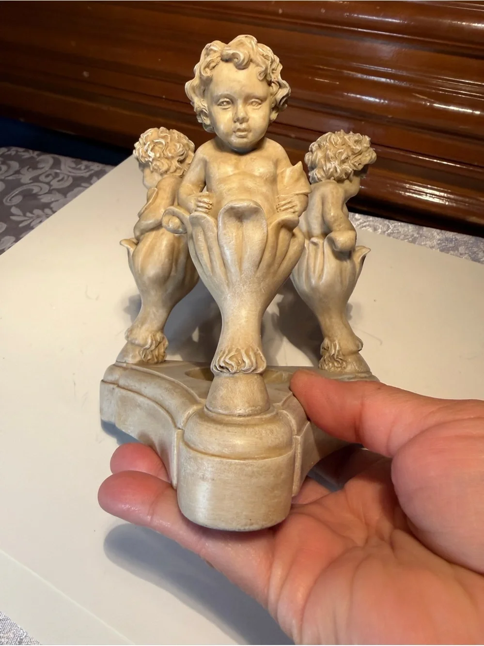 Vintage Resin Cherub Candle Holder features Three Cherubs Popping Out Of Flowers